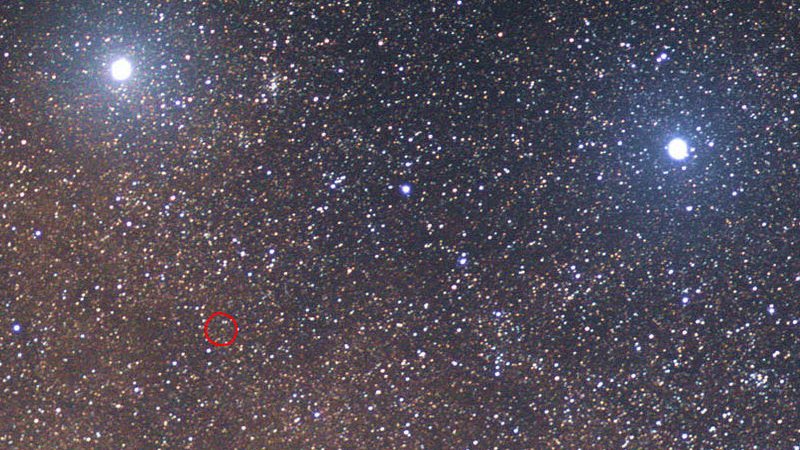 An optical image of the starfield near Proxima Cen. The two bright stars are (left) Alpha and (right) Beta Centauri. Proxima Centauri, the closest star to the Sun, is the faint red dot inside the red circle. A second planet, Proxima c, was recently discovered orbiting Proxima Cen every 5.3 years. Astronomers calculating the likely effects of the star’s wind on the planet conclude that a possible atmosphere would experience Earth-like conditions. Credit: Skatebiker