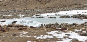 Aufeis formation in the area of a flat valley section below a springshed at 4,400 meters