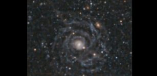 The giant, low surface brightness galaxy Malin 1 as imaged by the Megacam instrument on the 6.5m Magellan/Clay telescope.