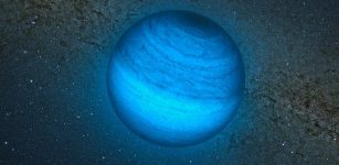 This artist’s impression shows the free-floating planet CFBDSIR J214947.2-040308.9. This is the closest such object to the Solar System. It does not orbit a star and hence does not shine by reflected light; the faint glow it emits can only be detected in infrared light. Here we see an artist’s impression of an infrared view of the object with an image of the central parts of the Milky Way from the VISTA infrared survey telescope in the background. The object appears blueish in this near-infrared view because much of the light at longer infrared wavelengths is absorbed by methane and other molecules in the planet's atmosphere. In visible light the object is so cool that it would only shine dimly with a deep red colour when seen close-up.