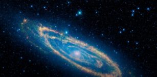 Gravitational 'kick' may explain the strange shape at the center of Andromeda