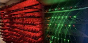 Hundreds of batteries sit on massive racks, blinking red and green, and are tested everyday inside Feng Lin's lab. The green and red lights mean the testing channels are working. Credit: Feng Lin.