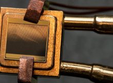 A thermophotovoltaic (TPV) cell (size 1 cm x 1 cm) mounted on a heat sink designed to measure the TPV cell efficiency. To measure the efficiency, the cell is exposed to an emitter and simultaneous measurements of electric power and heat flow through the device are taken. Credit: Felice Frankel