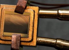 A thermophotovoltaic (TPV) cell (size 1 cm x 1 cm) mounted on a heat sink designed to measure the TPV cell efficiency. To measure the efficiency, the cell is exposed to an emitter and simultaneous measurements of electric power and heat flow through the device are taken. Credit: Felice Frankel