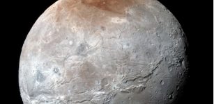 A Possible Source For Charon's Red Cap - Identified