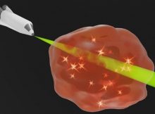 Induced transparency: The precise control of the energy flow (indicated by glowing particles in the fog) makes the artificial material become entirely transparent for the optical signal. Credit: Andrea Steinfurth / University of Rostock