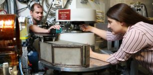 From left, ORNL's Matthew Frost and Leah Broussard used a neutron scattering instrument at the Spallation Neutron Source to search for a dark matter twin to the neutron. Credit: Genevieve Martin/ORNL, U.S. Dept. of Energy