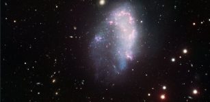 The dwarf galaxy NGC1427A flies through the Fornax galaxy cluster and undergoes disturbances which would not be possible if this galaxy were surrounded by a heavy and extended dark matter halo, as required by standard cosmology. Credit: ESO