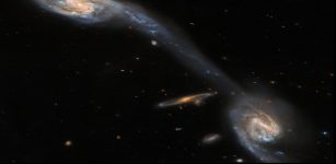 Hubble Inspects Two Galaxies Connected By A Luminous Bridge