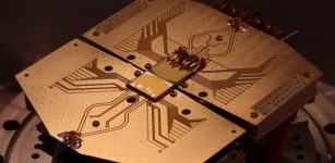 Quantum computer setup at the University of Sussex with two quantum computer microchips where quantum bits are transferred from one microchip to another with record speed. Credit: University of Sussex