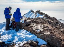 Collecting rocks on Månesigden mountain, in Heimefrontfjella. The polished surface of the rocks show that they have been covered by an ice layer. The researchers analysed the rocks for cosmogenic isotopes that can tell them how long it has been since the rocks were covered by ice. Carl (Calle) Lundberg is taking notes while PhD student Jenny Newall collects samples. Credit: Ola Fredin, NTNU